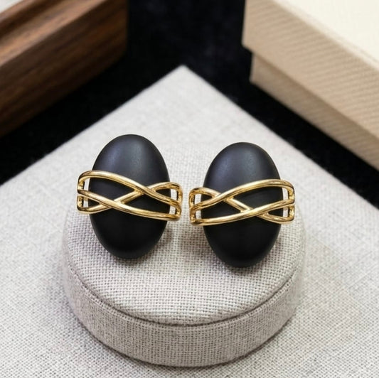 Jalparee Matte Black Oval Stud Earrings with Interlocking Gold Criss-Cross Overlay