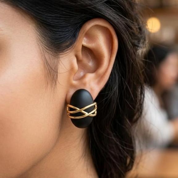Jalparee Matte Black Oval Stud Earrings with Interlocking Gold Criss-Cross Overlay
